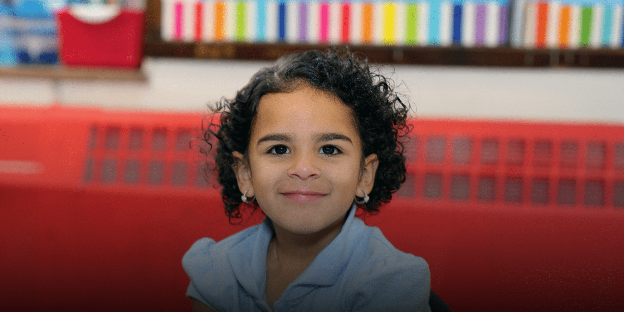 Smiling student sitting in class